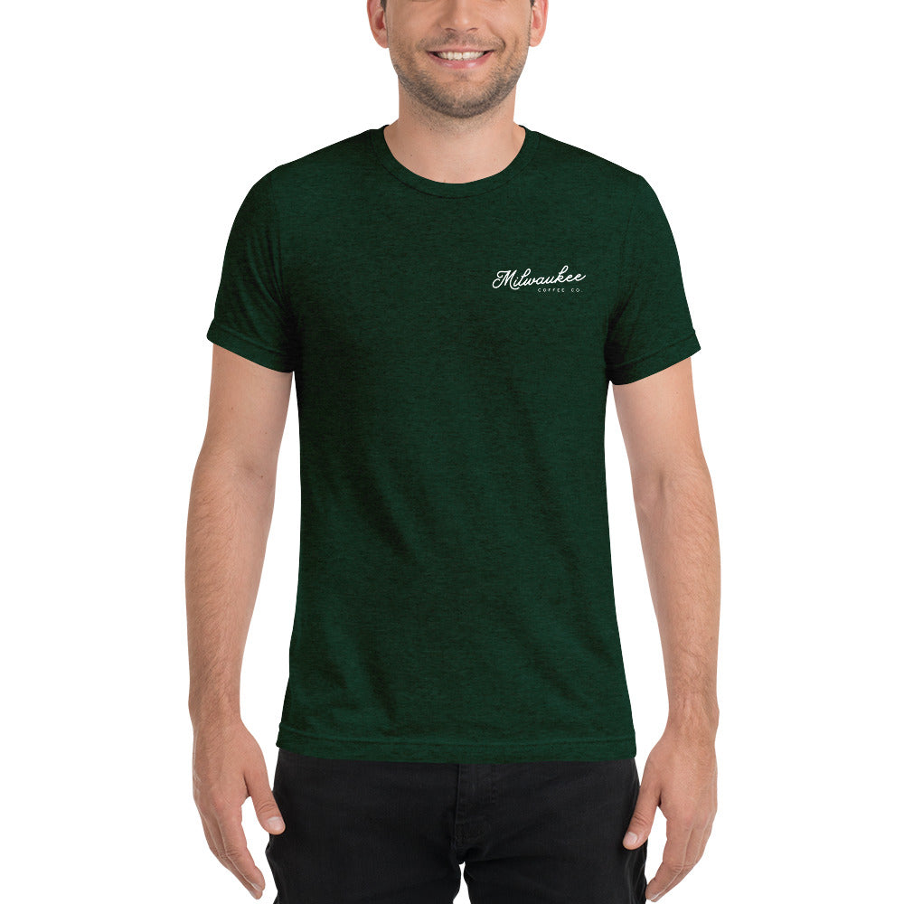 https://milwaukeecoffeeco.com/cdn/shop/products/unisex-tri-blend-t-shirt-emerald-triblend-front-60353c28ead94_1600x.jpg?v=1614101551